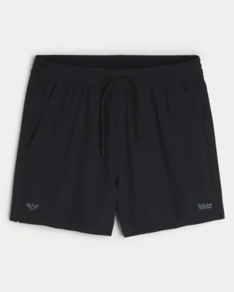 Aktiva shorts med logo, halvlånga