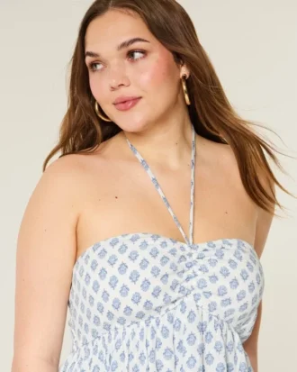Babydoll-top med halterneck och volanger