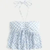 Babydoll-top med halterneck och volanger Babydoll-top med halterneck och volanger
