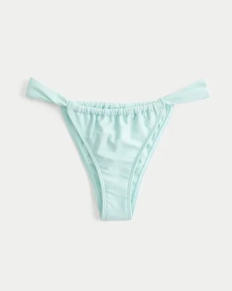 Bikinitrosa med breda band och högt skurna ben