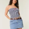 Curvy lågmidjad miniskort i mediumtvättad denim