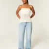 Curvy lågmidjade baggy jeans med slitna detaljer Curvy lågmidjade baggy jeans med slitna detaljer