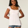 Enkel babydoll-top i satin med knytband Enkel babydoll-top i satin med knytband