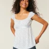 Enkel babydoll-top i satin med knytband Enkel babydoll-top i satin med knytband