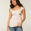 Enkel babydoll-top i satin med knytband Enkel babydoll-top i satin med knytband