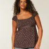 Enkel babydoll-top i satin med knytband Enkel babydoll-top i satin med knytband