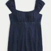 Enkel babydoll-top i satin med knytband Enkel babydoll-top i satin med knytband