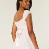 Enkel babydoll-top i satin med knytband Enkel babydoll-top i satin med knytband