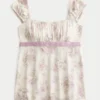 Enkel babydoll-top i satin med knytband Enkel babydoll-top i satin med knytband