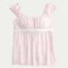 Enkel babydoll-top i satin med knytband Enkel babydoll-top i satin med knytband
