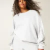 Enkel sweatshirt med nitar och grafiskt tryck