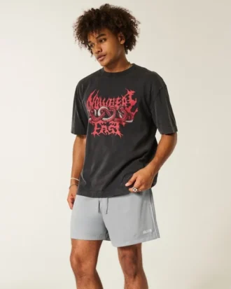 Fotbollsshorts i stickat material med logotyp, längd till mitten av låret