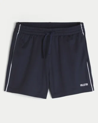 Fotbollsshorts i stickat material med logotyp, längd till mitten av låret