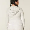 Gilly Hicks Hoodie med zip och vågig kant Gilly Hicks Hoodie med zip och vågig kant