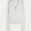Gilly Hicks Hoodie med zip och vågig kant Gilly Hicks Hoodie med zip och vågig kant