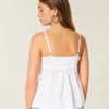 Glittrande broderad babydoll-top