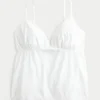 Glittrande broderad babydoll-top