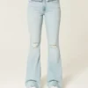 Högmidjade, slitna, ljusblå flare-jeans Högmidjade, slitna, ljusblå flare-jeans