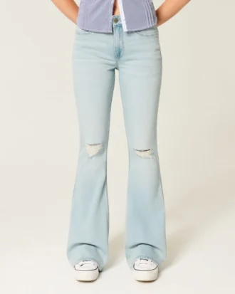Högmidjade, slitna, ljusblå flare-jeans
