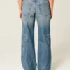 Låg midja, medium tvätt, baggy jeans med stjärngrafik