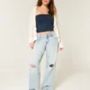 Låg midja, slitna, ljusblå baggy jeans