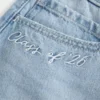 Lågmidjad miniskort i denim från Class of ’26 Lågmidjad miniskort i denim från Class of ’26