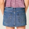 Lågmidjad miniskort i denim med nitar Lågmidjad miniskort i denim med nitar