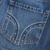 Lågmidjad miniskort i denim med nitar Lågmidjad miniskort i denim med nitar