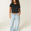 Lågmidjade baggy jeans med slitna detaljer Lågmidjade baggy jeans med slitna detaljer