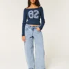 Lågmidjade, ljusblå, avsmalnande baggyjeans