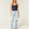 Lågmidjade, ljusblå, slitna, lösa jeans