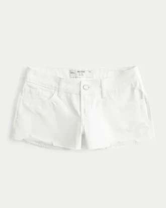 Lågmidjade minishorts i vit denim med slitna detaljer