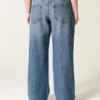 Lågmidjade, mörkblå baggyjeans med broderad text ”Class of ’26” Lågmidjade, mörkblå baggyjeans med broderad text ”Class of ’26”
