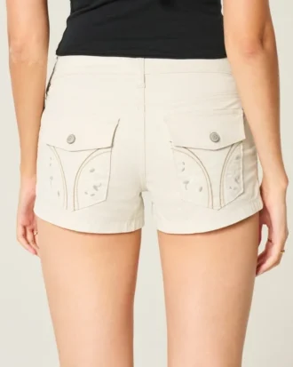 Lågmidjade poplinshorts med blommiga bakfickor