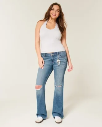 Lågmidjade, slitna bootcut-jeans i medium tvätt