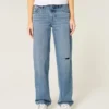 Lågmidjade, slitna jeans i medium tvätt Lågmidjade, slitna jeans i medium tvätt