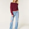 Lågmidjade, slitna jeans i medium tvätt med rak passform