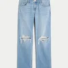 Lågmidjade, slitna jeans i medium tvätt med rak passform