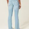 Lågmidjade, slitna, ljusblå bootcut-jeans med broderier