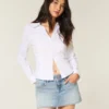 Ljus tvättad miniskort i denim med nitar Ljus tvättad miniskort i denim med nitar