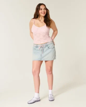 Ljus tvättad miniskort i denim med snörning
