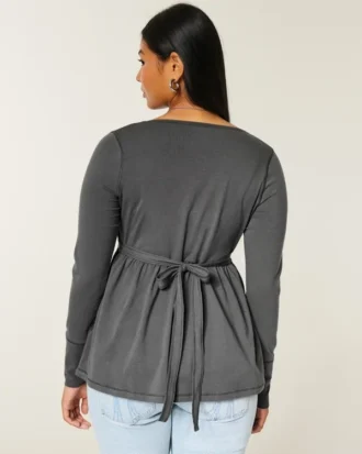 Långärmad babydoll-top med grafiskt tryck och pinch bust