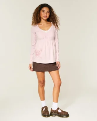 Långärmad babydoll-top med grafiskt tryck och pinch bust