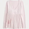 Långärmad babydoll-top med grafiskt tryck och pinch bust Långärmad babydoll-top med grafiskt tryck och pinch bust