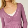 Långärmad babydoll-top med snörning vid bysten Långärmad babydoll-top med snörning vid bysten