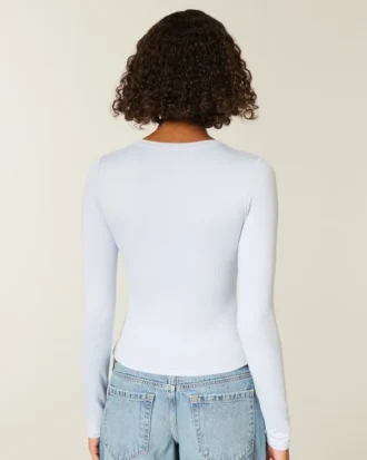 Långärmad sömlös baby-T-shirt i stretchig trikå