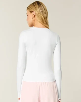 Långärmad sömlös baby-T-shirt i stretchig trikå