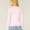Långärmad sömlös baby-T-shirt i stretchig trikå
