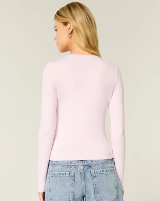 Långärmad sömlös baby-T-shirt i stretchig trikå