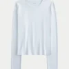 Långärmad sömlös baby-T-shirt i stretchig trikå
